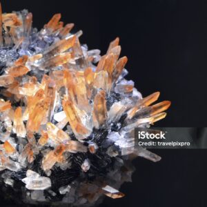 Home macro of citrine quartz crystals grown out from hematite. copy space.